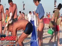 Pretty topless bikini girls are running on the beach
