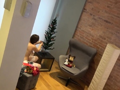 My nude girlfriend doing Christmas decorations naked
